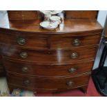 A Georgian Mahogany bow fronted Chest of Drawers with oval Brass handles. 54H x 18D x 37W cms