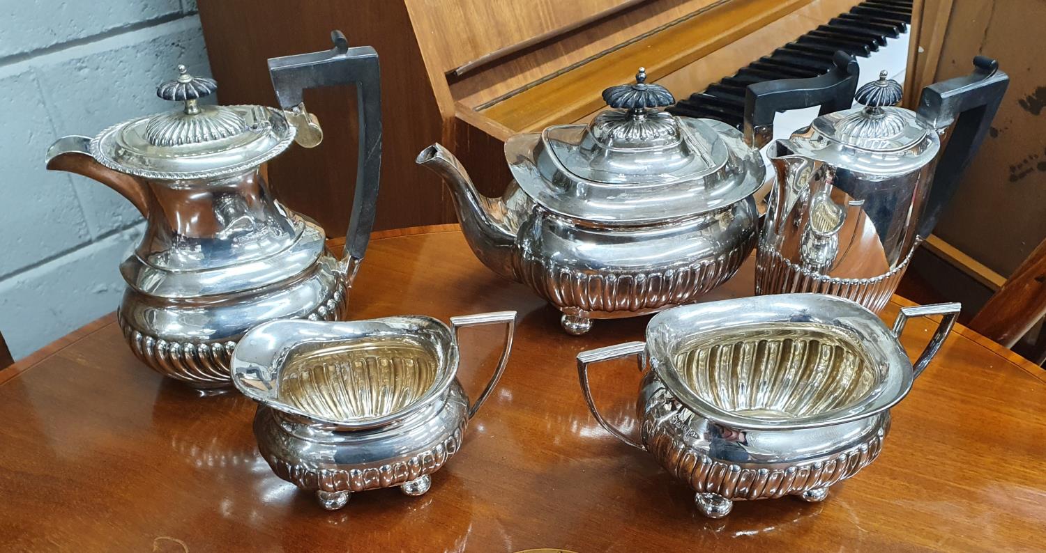 A good Walker and Hall Silver Plated teaset along with two coffee pots.
