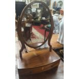 A Regency Mahogany bow fronted Crutch Mirror. 54H x 18D x 37W cms approx.