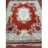 A good Oriental Carpet with red ground. 270 x 360 cms approx.