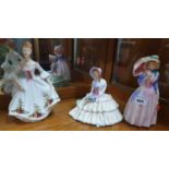 A Royal Doulton Figure of The Country Rose (HN3221), Miss Demure (HN1402) and Daydreams (HN1731).
