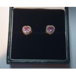 A pair of pink sapphire and diamond heart-shape earrings. Total sapphire weight 0.78ct, stamped to