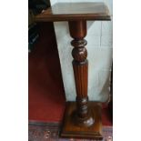 A Mahogany Torchere with reeded upright. 35 x 35 x H 101 cm approx.