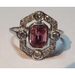 A pink tourmaline and brilliant-cut diamond cluster ring. Tourmaline calculated weight 1.10cts,