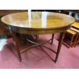 A really good Edwardian Mahogany inlaid oval centre Table with a highly carved freeze on tapered