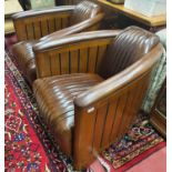 A Fantastic pair of Brown Leather Club Chairs in the Art Deco style with a ribbed upholstered