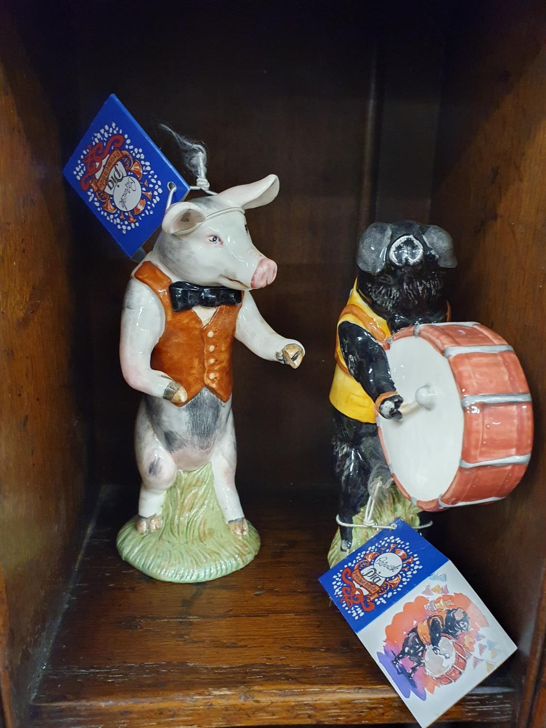 Four good Beswick musical Pigs.