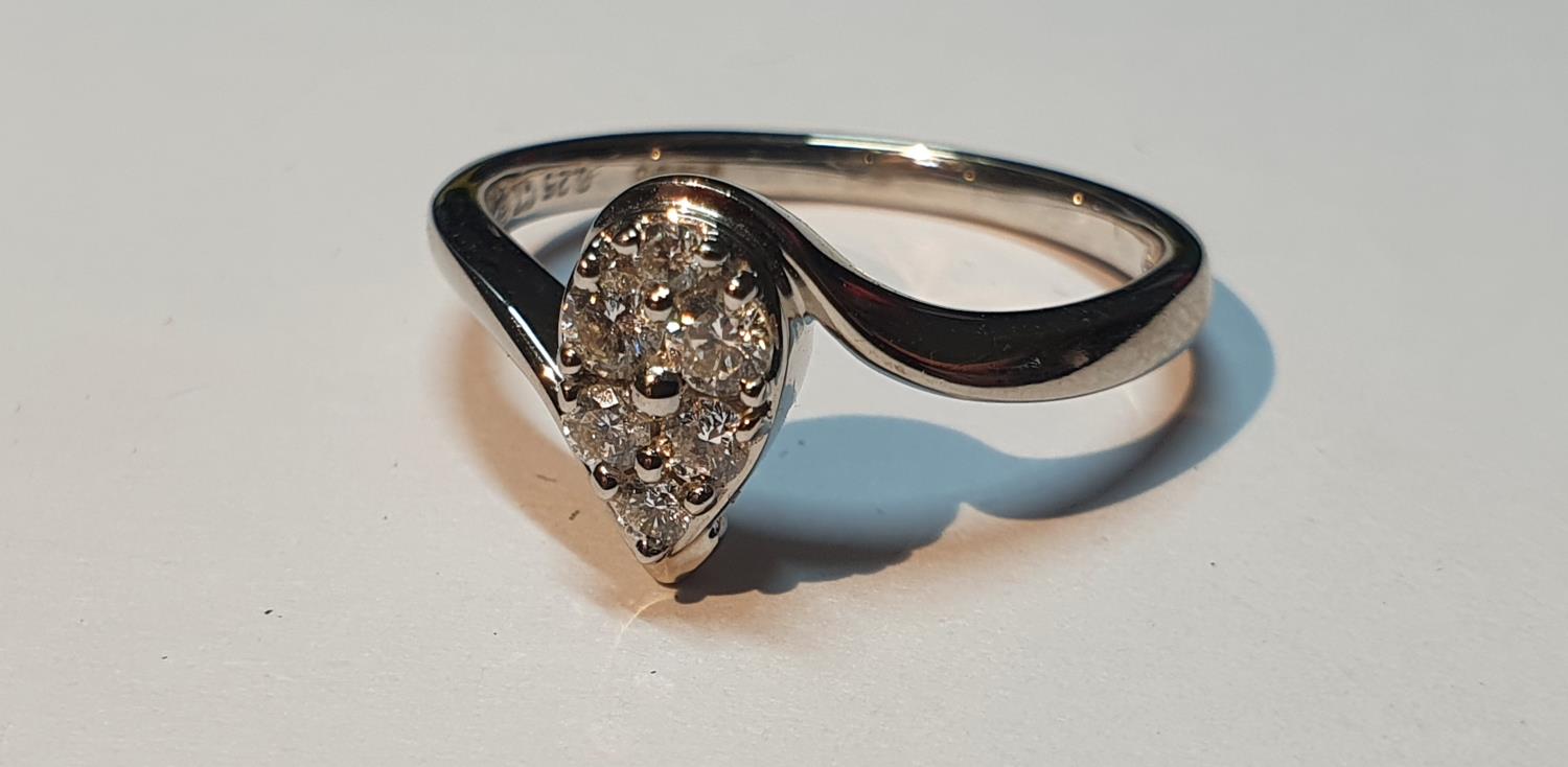 An 18ct gold brilliant-cut diamond pear-shape cluster ring. Total diamond weight 0.33ct, stamped