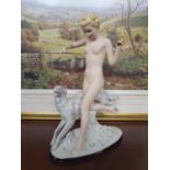 A large Royal Dux Art Deco-style tinted Bisque and glazed Figure of Female nude throwing a ball