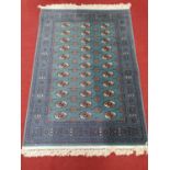 A really good blue ground Rug with repeating pattern and multi borders. 170 x 118 cm approx.