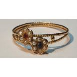 A split pearl and gem-set floral dress ring. Ring size P. 1.2gms.
