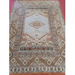 A large rust ground Carpet with geometric style design. 287 x 200 cm approx.