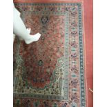 A good Persian Rug with rust ground.