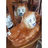 Two Staffordshire style Lions. H 25 cm approx.