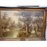A very large Oil on Canvas of a river scene with a path. In a good gilt frame. 94 x 64 cm approx.
