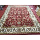 A large red ground Carpet with unique design and multi borders. 297 x 415 cm approx.