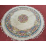 A Circular Cream ground Carpet. D 217cm approx.