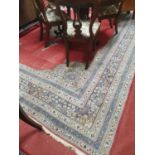 A large Carpet with red ground and multi borders 370 x 280cm approx. (worn).