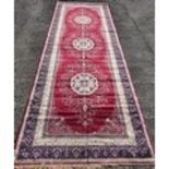 A beautiful rich red ground Persian Style Carpet with a cask and carpet unique pattern and unique