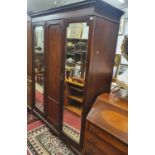 An Edwardian Mahogany and inlaid Wardrobe with twin mirrored doors. W 163 x D 56 x H 210 cm approx.
