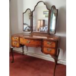 A 20th Century Walnut Dressing Table with triptych mirrored back on carved cabriole supports. H158 x