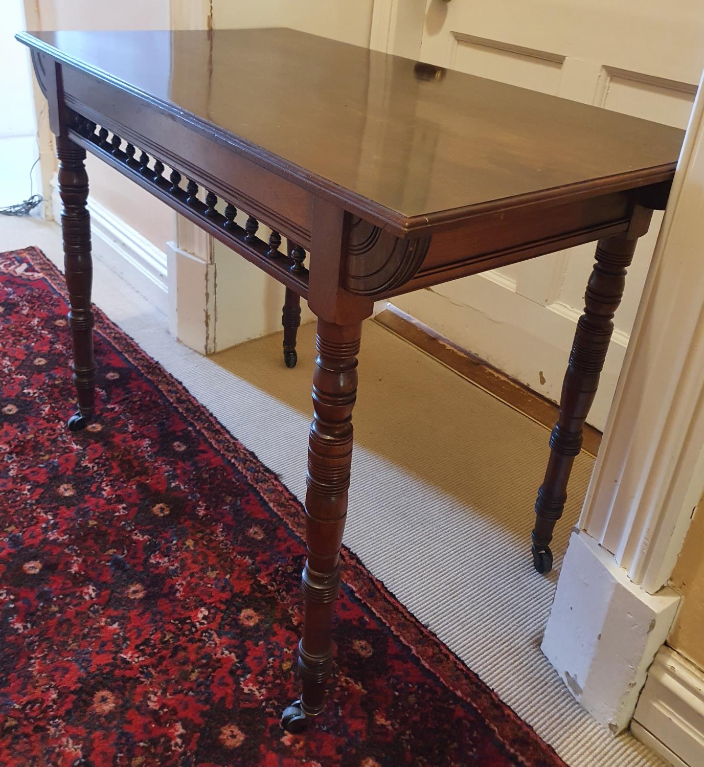 A Arts and Crafts Walnut Side Table.