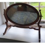 An Edwardian Mahogany oval Crutch Mirror. H45 x D21 x W51cm approx.