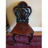 A good pair of early 19th Century Mahogany Hall Chairs with highly pierced backs and heavy solid