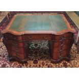 A really good 19th Century Mahogany serpentine fronted Pedestal Desk with carved canted corners