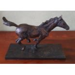 A Bronze Sculpture of a Racehorse. Signed Arnup. H23 x D10 X W33cm approx.
