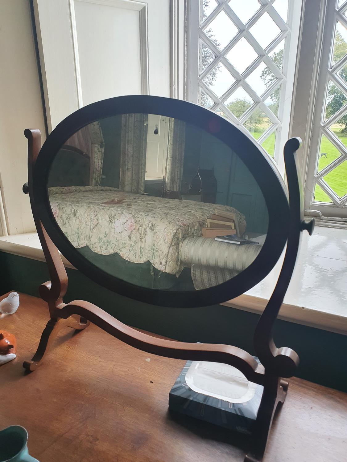 An Edwardian Mahogany swivel Crutch Mirror. 49 x H53cm approx.