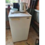 A Whirlpool Fridge, Nordmende Microwave along with a toaster and kettle.