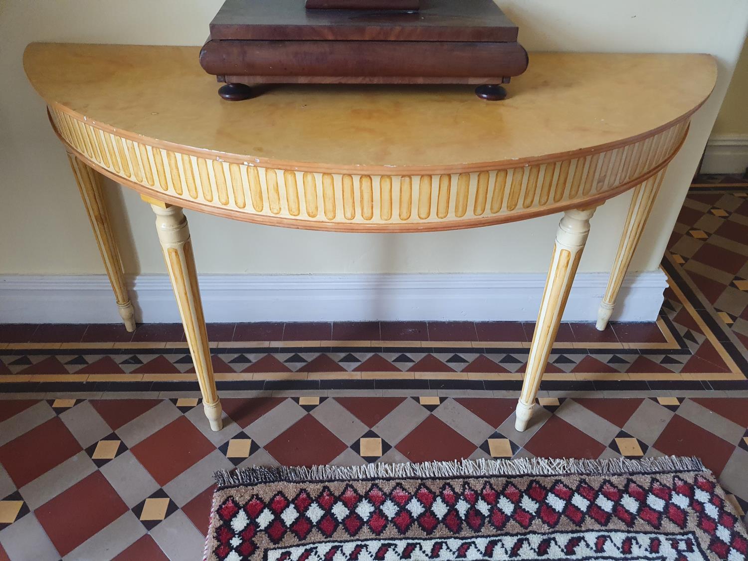 A pair of half moon Side Tables painted in the Regency style. On turned supports. W154 x H81 x