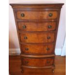 A Mahogany bow fronted miniature Tallboy. W55 x D40 x H105cm approx.