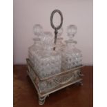 A good Silver Plated and Crystal Decanter set with pierced outline.