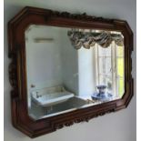 An early 20th Century Oak Mirror with bevelled glass. H66 x W91cm approx.