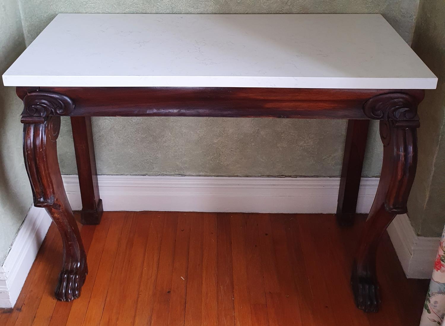 A good early 19th Century Rosewood Marble topped Side Table, possibly Irish, with carved frieze