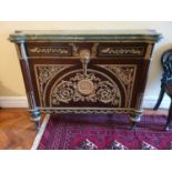 A Superb pair of Mahogany Side Cabinets profusely mounted with ormolu mounts. On turned supports and