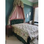 A Mahogany Showframe Headboard with green deep buttoned back along with a floral and pink
