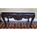 A fantastic Irish Mask Table in the Georgian style with highly carved front, hairy paw feet and