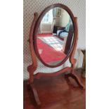 An Edwardian Mahogany Crutch Mirror.