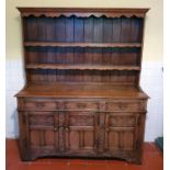 A lovely 20th Century Oak Dresser in the Medieval style. H183 x D46 x W152cm approx.