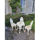 A fabulous heavy cast iron set of three Chairs and Table with pierced outline.