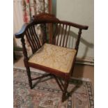 An Edwardian Mahogany Inlaid Corner Chair with bar back and turned stretchered supports. H72 x D57 x