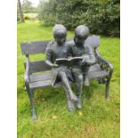 A Fabulous Bronze Sculpture of a Boy and a Girl on a bench reading. H92 x D67 x W100cm approx.