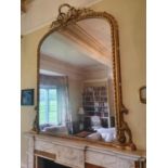 A Magnificent Victorian Timber and Plaster Gilt Overmantel Mirror with a highly carved top and roped
