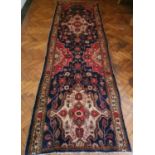 A good blue ground Persian Surok Runner with unique medallion design. 332 x 98 cms approx.