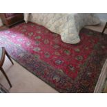 A Rich red ground Persian Tabriz Carpet with unique all over design. 197 x 298cm approx.