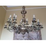 A Most Magnificent six branch Brass oversized Chandelier profusely decorated with floral decoration.