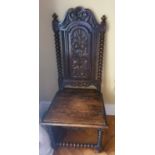 A good single Oak Hall Chair with a carved back and solid seat. H118 x D44 x W52cm approx.